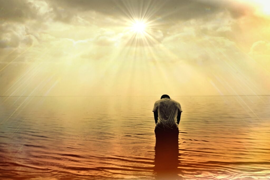 Person standing in the river practicing visualization and letting go