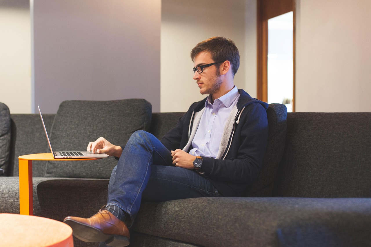 Confident person reflecting on how to manifest a successful business strategy.